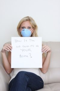 woman-holding-sign-about-healthy-air
